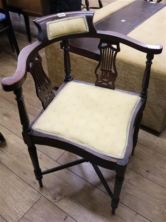 An Edwardian inlaid mahogany corner elbow chair